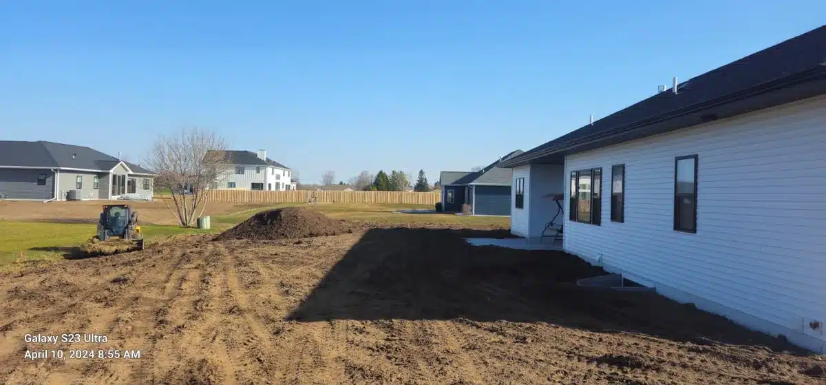 Grading and screened topsoil installation on a new build lot in Manitowoc WI — Fast Grass Lawns